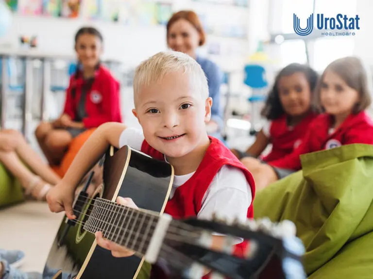 Child with disability at camp, strumming a guitar with a group of kids and teachers