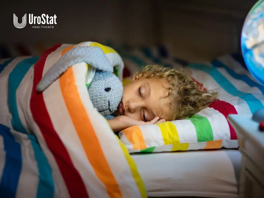 Child sleeping with a stuffed bunny under colorful striped bedding