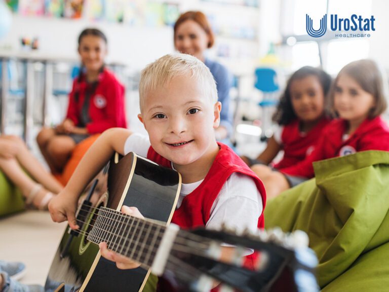 Child with disability at camp, strumming a guitar with a group of kids and teachers
