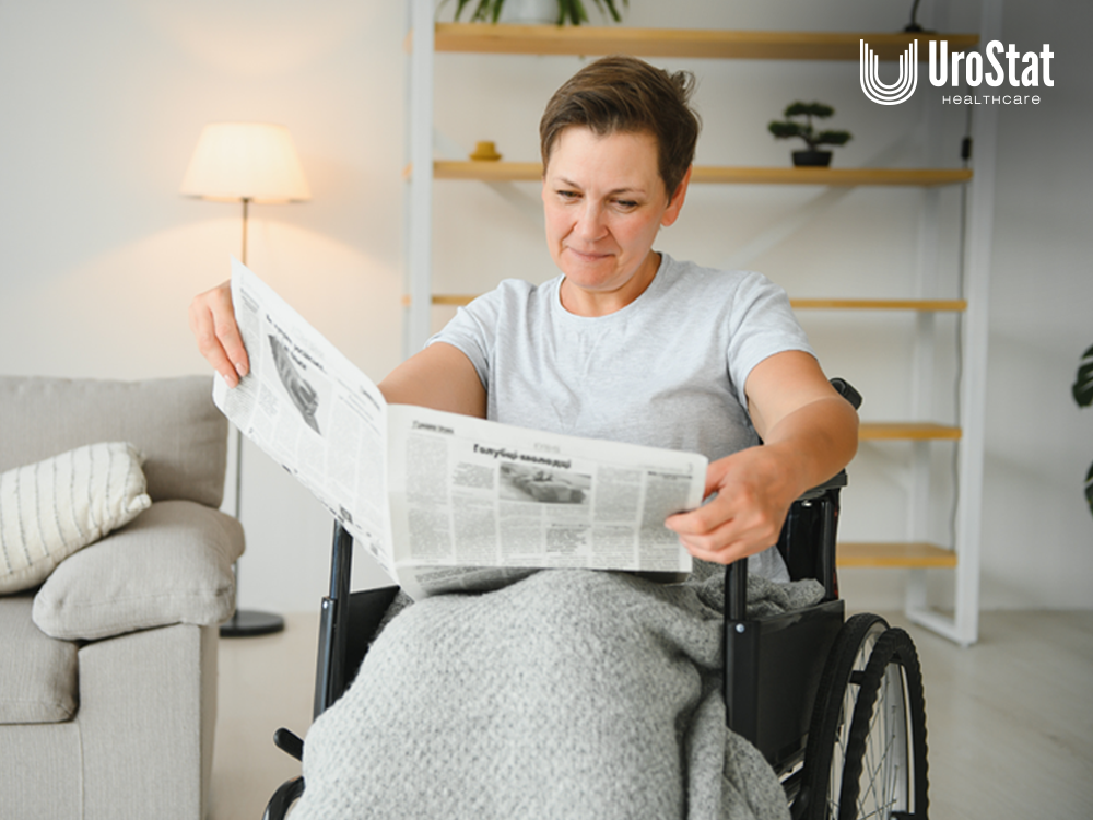 Woman in wheelchair reading newspaper