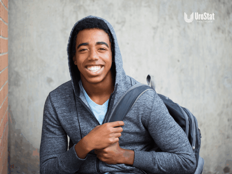 Teenager with bookbag happy