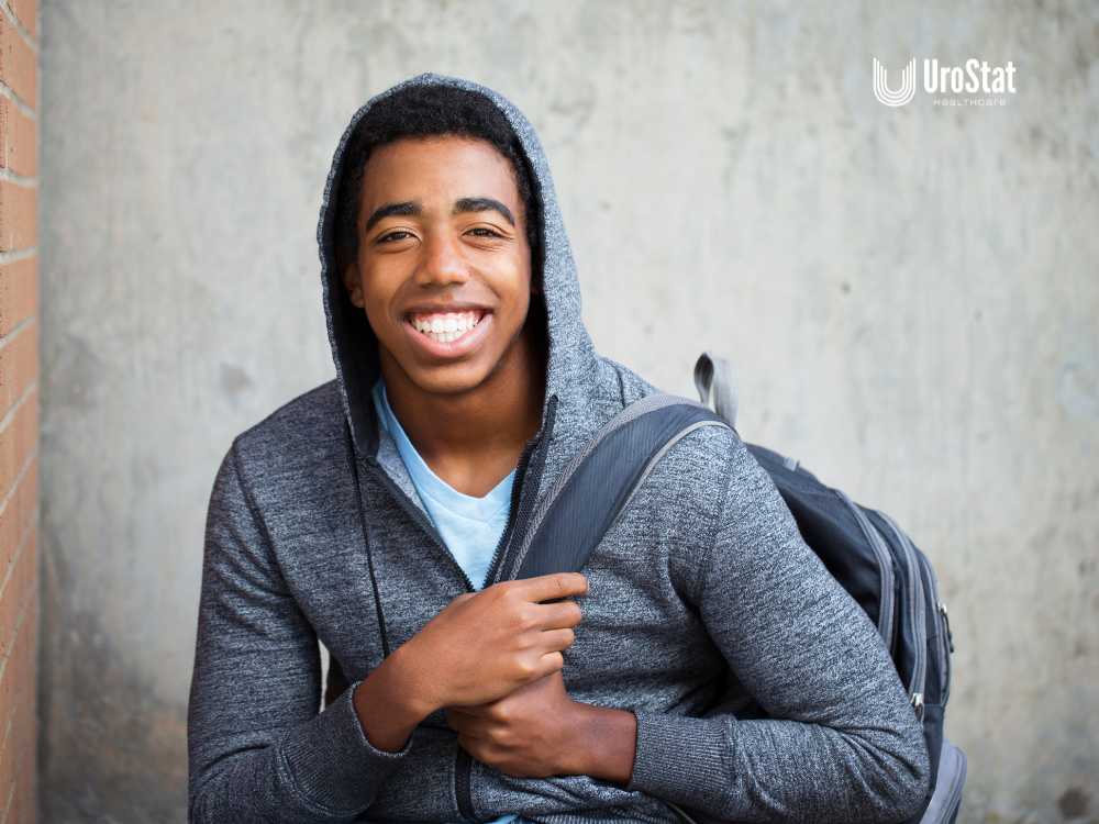 Teenager with bookbag happy