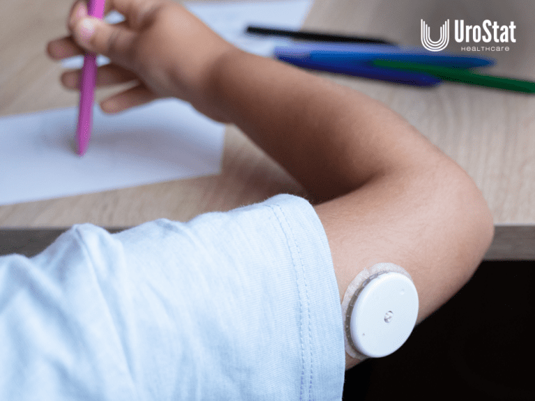 Child with CGM on the back of their arm