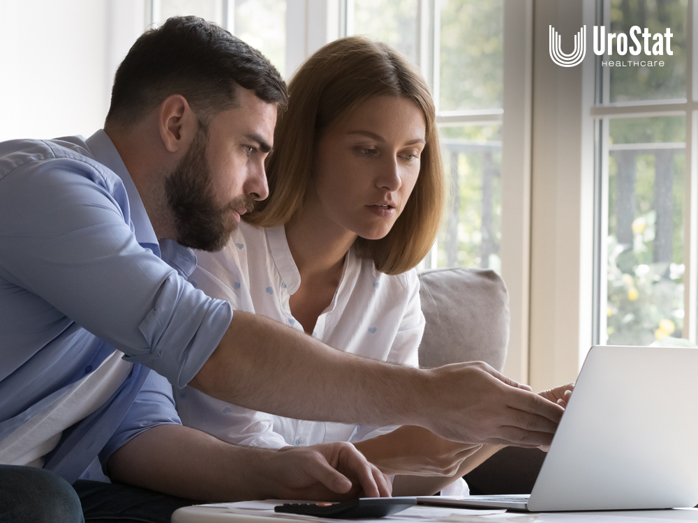 Parents looking over laptop for information