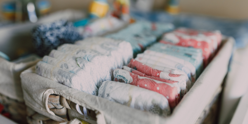 Diapers stacked in an organization tote
