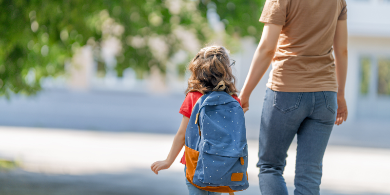 Mom and daughter walking outside