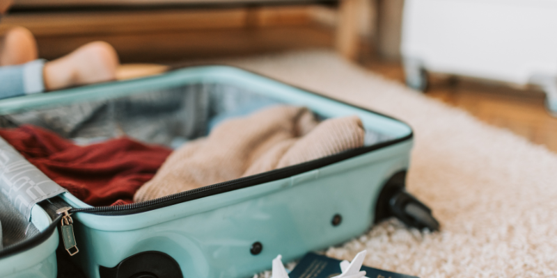 Open luggage with clothes inside of it